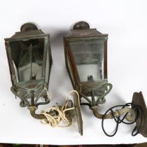 A pair of Victorian copper-framed wall lanterns, with embossed VR cypher, overall height 64cm,