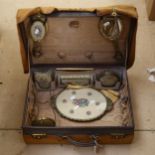 An early 20th century lady's leather vanity case, with fitted interior complete with dressing
