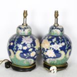 A pair of Oriental ceramic table lamps with enamelled decoration, height overall 45cm