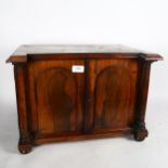A rosewood Regency break-front collector's cabinet, with drawer-fitted interior (missing 2 drawers),