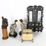 A fretwork wall shelf, height 33cm, 2 composition figures on stands, a scroll case and a composition