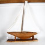 A scratch-built model sailing boat on stand, height overall 1m