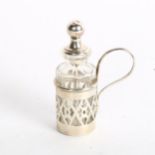 A small silver overlay scent bottle