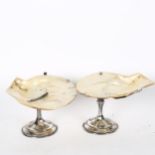 A pair of Art Nouveau bon bon dishes, with shell plates on silver plated mounts, height 12cm