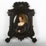 Portrait on panel of a lady, in ornate ebonised frame, height 25cm overall