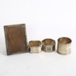 3 decorative silver napkin rings, and a small rectangular silver-fronted photo frame (4)