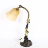 A Vintage steam punk industrial table lamp, with glass lamp shade, adjustable neck, fully extended