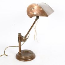 An Antique copper student's desk lamp, with swivel shade, height 43cm