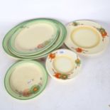 A set of 7 Clarice Cliff plates with orange floral decoration, and a set of 5 Clarice Cliff plates