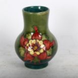 A Moorcroft Pomegranate vase, 10.5cm, boxed