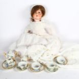 Vintage doll's tea set with Snow White theme, and a German Spezial porcelain-headed doll with