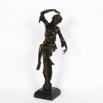 An Art Nouveau style patinated bronze figural sculpture, dancing girl, unsigned, on black marble