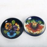 A boxed Moorcroft Anna Lily dish, 11.5cm, and a Moorcroft dish with tube-lined pansies