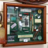 A display of fishing accessories, in glazed case, height 37cm overall