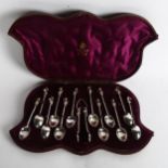 A cased set of early 20th century silver plated teaspoons, with cherub finials and spiral handles,