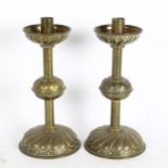 A pair of Gothic brass candlesticks, height 26cm