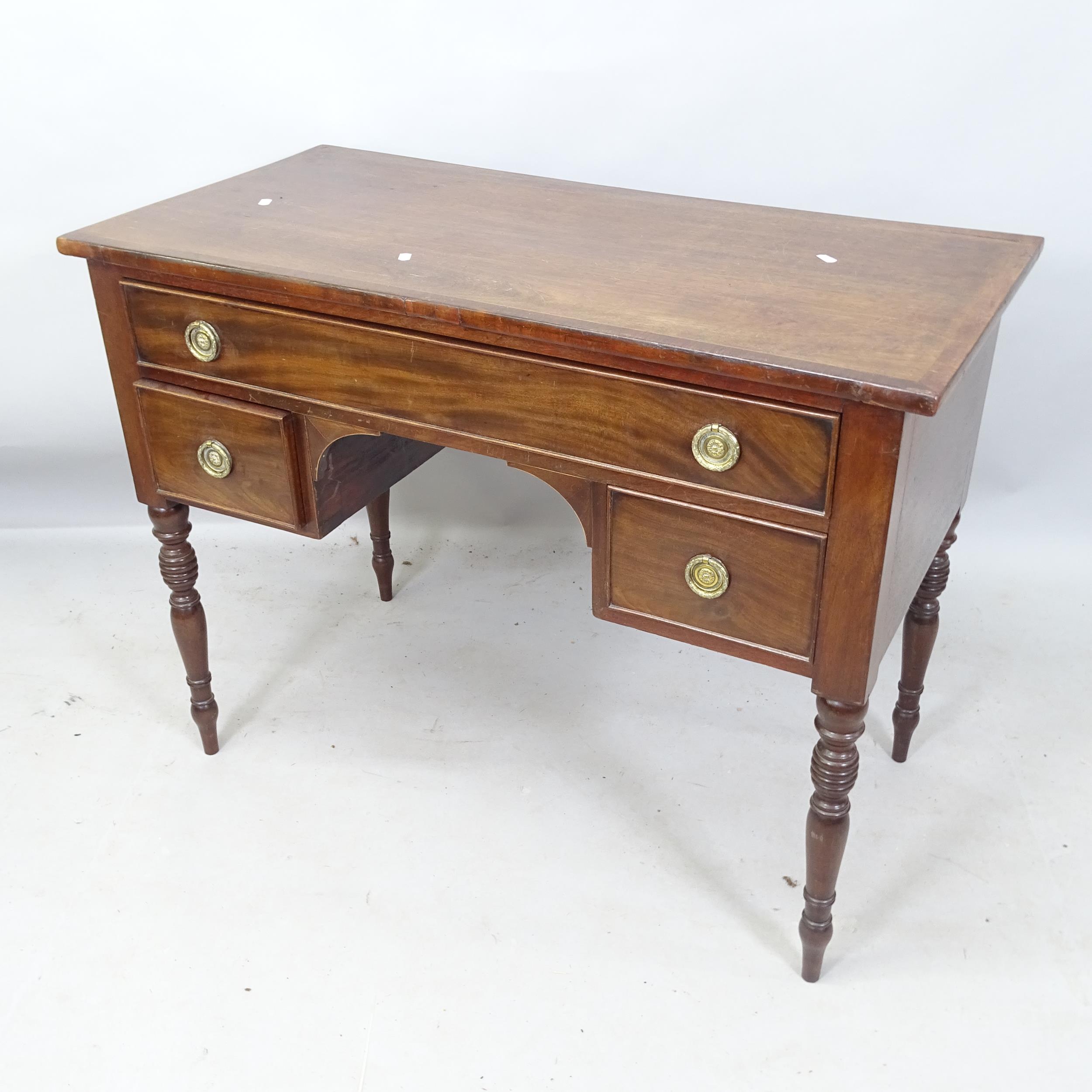 An Antique mahogany and satinwood-strung lady's kneehole writing desk, with 3 fitted drawers, on