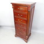 A reproduction mahogany chest of 7 drawers, with 2 turned pilasters, brass mounts, on bracket