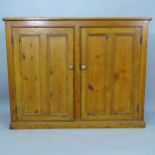 A Vintage stained pine hall cabinet, with 2 panelled doors, 137cm x 107cm x 39cm