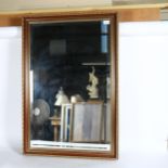 A modern gilt-framed bevel-edge wall mirror, 97cm x 66cm