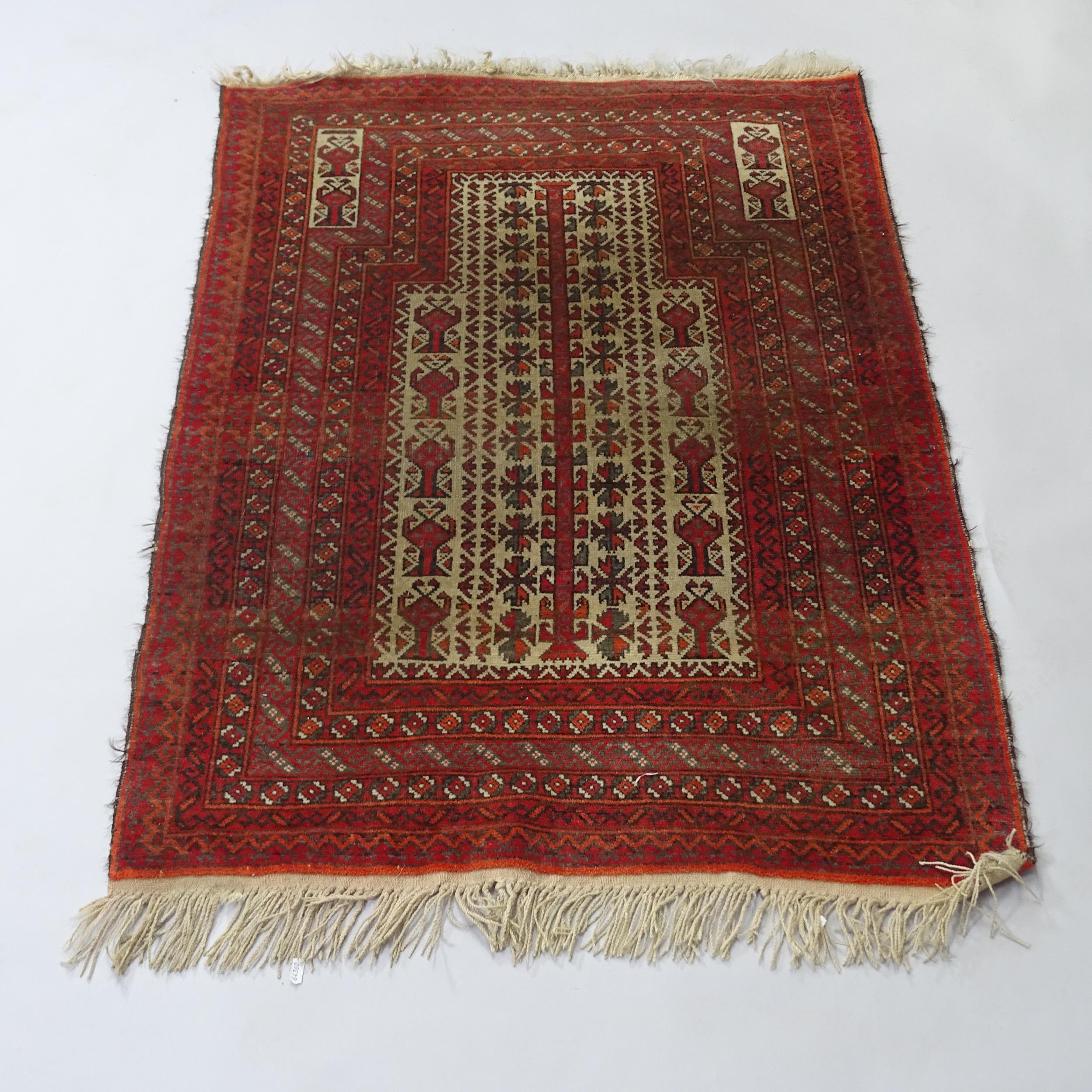 A Persian red ground prayer rug, 130cm x 90cm