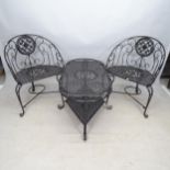 A black painted wrought-metal 2-tier garden table, 115cm x 52cm x 70cm, and 2 matching chairs (3)