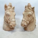 A pair of textured concrete garden horse heads, height 40cm