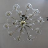 A brass and glass 10-branch chandelier, with lustre drops