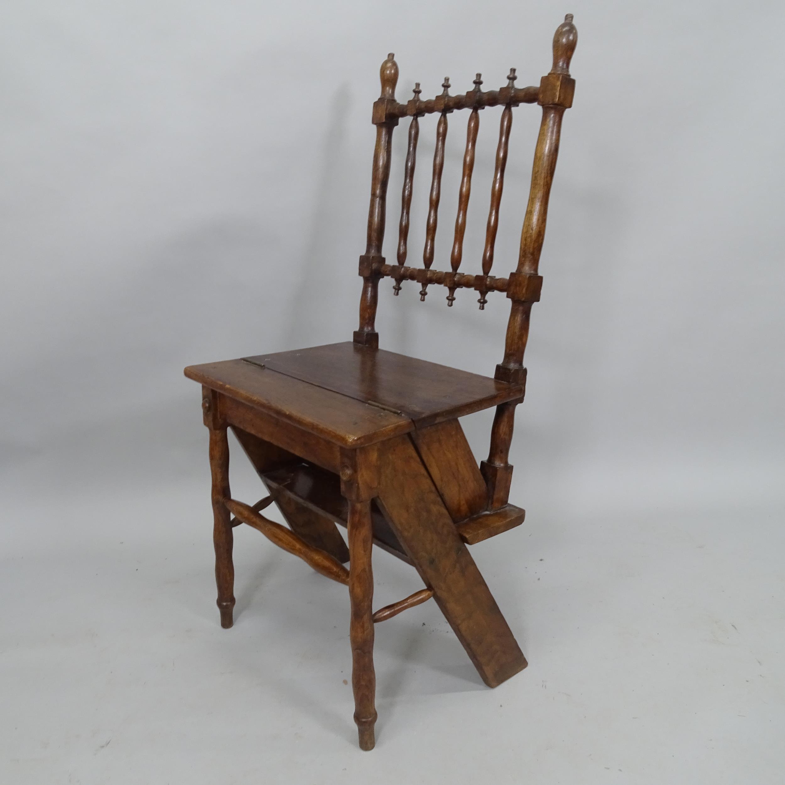 A 19th century oak metamorphic library step chair, with turned spindle back and legs