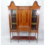 A 19th century mahogany inverted break-front cabinet on stand in 2 sections, 141cm x 195cm x 43cm