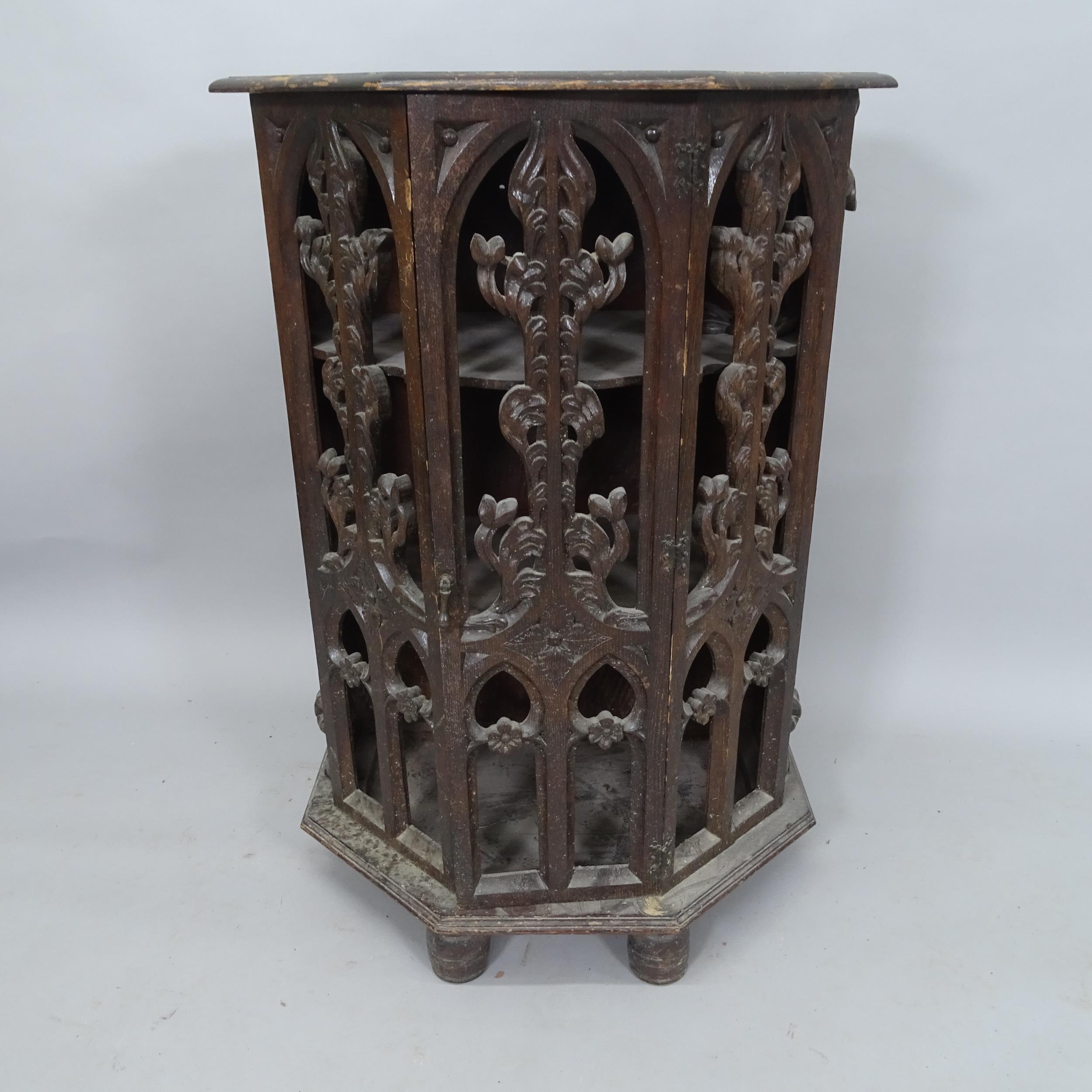 A Victorian oak Gothic single-door cabinet, with carved and pierced decoration, 60cm x 89cm x 34cm