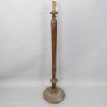 An Antique mahogany standard lamp, with fluted column and carved decoration, H150cm