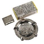 A large Dutch silver plated cigarette box holder, a similar small matchbox holder and matching