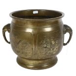 A large Indian brass jardiniere, with elephant design handles and embossed panels, diameter 30cm