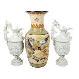 A pair of moulded porcelain ewers, 38cm, a Vietnamese vase, and a large vase with dragon decoration