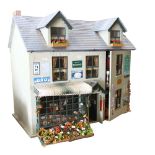 A doll's house titled "George Street", a greengrocer's with living accommodation above, 2 floors