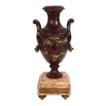 Parcel-gilt patinated bronze urn on marble base with ormolu mounts, height 41cm Good condition