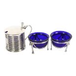 A silver drum-shape mustard pot with blue liner, London 1912, and a pair of Adams style silver