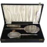 A mid-century 4-piece silver-backed dressing table set, with engraved decoration, in original fitted