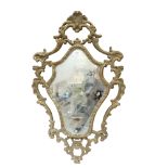 A shield-shape painted and gesso-framed wall mirror, height 74cm