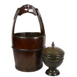 A Chinese steel-bound elm well bucket, height 63cm, and a patinated brass urn and cover, on turned