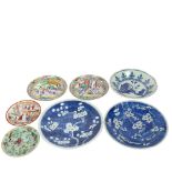 A group of Chinese plates, including blue and white, famille verte, celadon etc, largest diameter