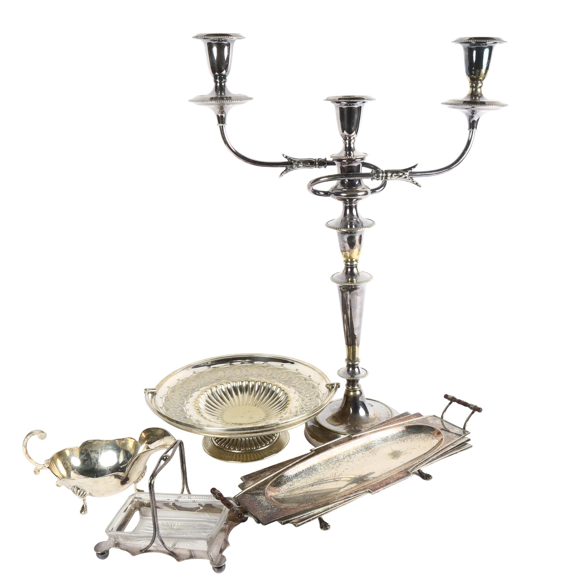 A silver plated 2-branch table candelabra, height 53cm, an Art Deco style 2-handled tray, sauce