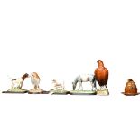 A group of 4 Royal Doulton animal figures, on separate plinths, including a Barn owl, 2 Pointers,