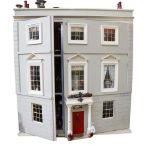 A Regency style doll's house, over 3 floors with fitted interior, H90cm, L79cm, W44cm