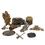 An unusual folding pocket eye glass, an antimony condiment set in the form of doves, a brass lion on