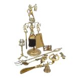 A group of Vintage Cornish brassware, including a companion set decorated with Dartmoor Pisky, brass