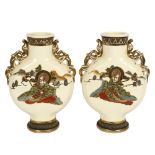 A pair of Japanese cream ground moon flasks, with gilded dragon handles, height 32cm