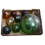 A group of coloured glass balls and fishing floats, largest diameter 27cm (9)