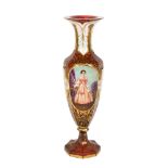 A 19th century Bohemian cranberry glass portrait vase, allover gilded and white enamelled
